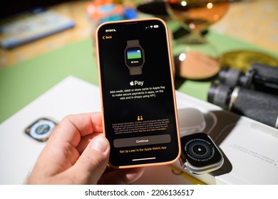 London, United Kingdom - Sep 23, 2022: Unboxing Unpacking Of New Titanium Apple Watch Ultra Designed For Extreme Activities - Pairing With Iphone 14 Pro Setting Apple Pay Services Menu