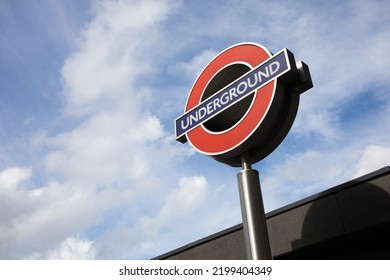 London, United Kingdom - SEP 8, 2022: Isolated Sign Of London Underground Metro With A Blue Sky During Daytime. Subway Sign.