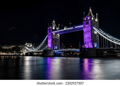 London, United Kingdom - September 16, 2022: The Tower Bridge Lit In Purple To Honour The Queen