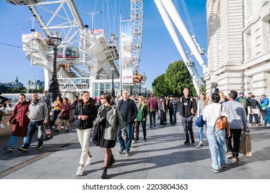 London, United Kingdom - September 17 2022: People Walking Towards London Eye Ferris Wheel