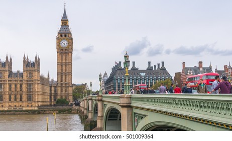 LONDON, UNITED KINGDOM-18 OCT 2016: Big Ben And Houses Of Parliament During Cloudy Day Taken From Busy Westminster Bridge Beside The River Thames.