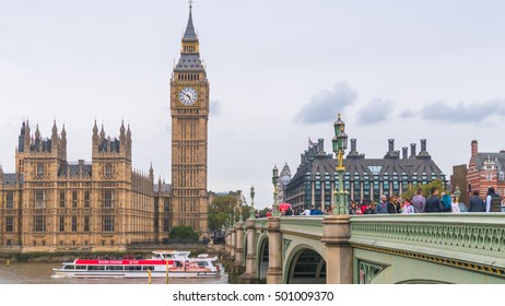 LONDON, UNITED KINGDOM-18 OCT 2016: Big Ben And Houses Of Parliament During Cloudy Day Taken From Busy Westminster Bridge Beside The River Thames.