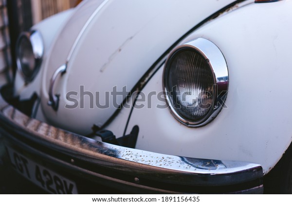 London, West | UK - \
2021.01.09: Early 60s VW Beetle, or informally the VW Bug, Parked\
on the side on sunny\
day