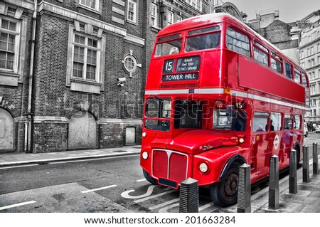 Londoner red double decker vintage bus in a street, selective color