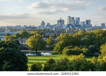 London's Canary Wharf cityscape. Greenwich Boating Pond