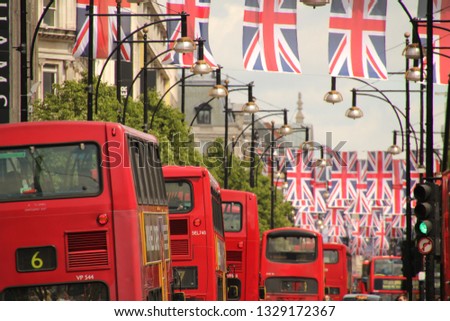 London's red buses and Union Jack flags in Oxford Street