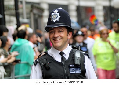 London/UK 06/28/14 Pride In London Parade. A Cheerful Policeman Enjoying The Procession And The Atmosphere