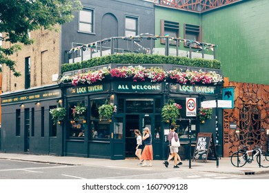 London/UK - 17/07/2019: People Walking Past The Lock Tavern On Chalk Farm Road In Camden Town. Pubs Are A Social Drinking Establishment And A Prominent Part Of British Culture