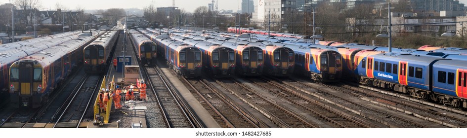 London/UK - 2/22/2019: Many Trains Are Awaiting Orders At Clapham Junction Station, One Of The Most Busy Railway Stations In The World. This Is A Panoramic Image.