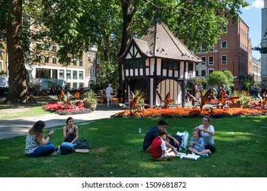 LONDON,UK -JULY 29,2019 : People Enjoying Summer At Soho Square In London