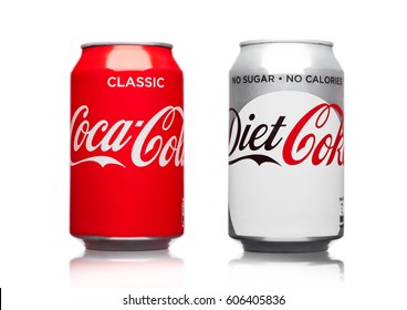 LONDON,UK - MARCH 21, 2017 : Cans of Coca Cola classic and Diet drink  on white background. The drink is produced and manufactured by The Coca-Cola Company.
