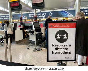 London,UK/ September 25,2020：The Public Health Notice In Heathrow Airport Warning People Keep A Safe Distance From Others.