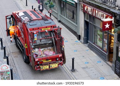 LONDON,UK-26.2.2021: Top View Of Red Refuse Collection Vehicle Parking In Alleyway Collecting Rubbish In Front Of Pret A Manger Coffee In London, England, UK