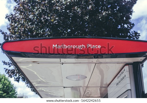 London/UK-30/7/18: Marlborough Road bus stop on Abbey\
Road. A bus stop is a designated place where buses stop for\
passengers to board or alight from a\
bus