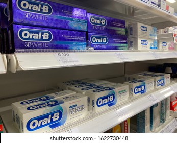 London,UK/January 14,2020：Kinds Of Oral-B Toothpastes Displayed On Shelves Of A Pharmacy Store. Oral-B Is A Brand Of Oral Hygiene Products.