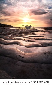 The Lone Boat During The Amazing Sunset At A Sea Weed Farm Between Nusa Ceningan And Nusa Lembongan