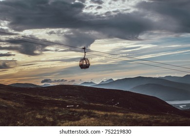 A Lone Cable Car Hanging With A Beautiful View From The Top Of The Nevis Range, Scotland.