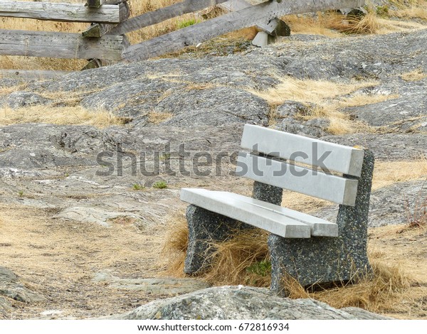 Lone Cement Bench On Rocky Outcropping Stock Photo Edit Now
