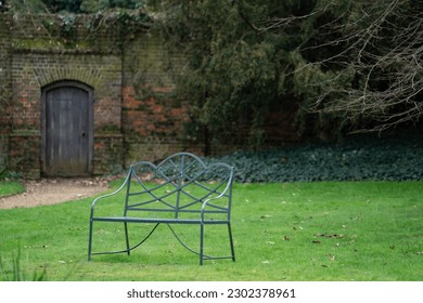 Lone public chair in a garden - Shutterstock ID 2302378961