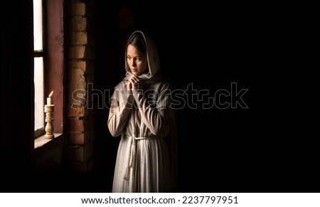 Lone retro rural veil cloth jew slave maid life sad poor lady face look cry plead bible Jesus. Holy cold kid child think ask beg old biblical god Christ wait even flame light war home room text space
