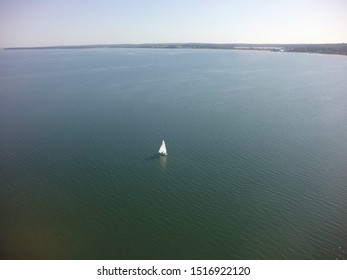 Lone Sailboat On Peconic Bay In Hampton Bays ,NY.