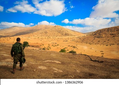 A Lone Soldier Walks Through The Desert After A Long Training Session