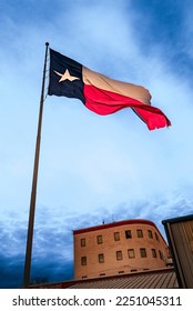 Lone Star Texas State Flag waving in the wind over Odessa in Texas, USA, dramatic cloudscape