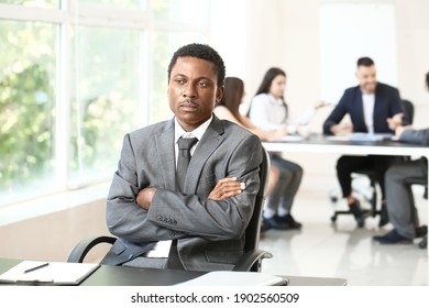 Lonely African-American Businessman In Office. Stop Racism