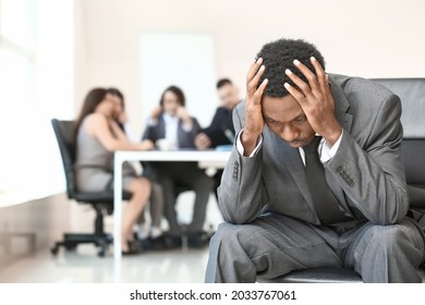 Lonely African-American Businessman In Office. Stop Racism