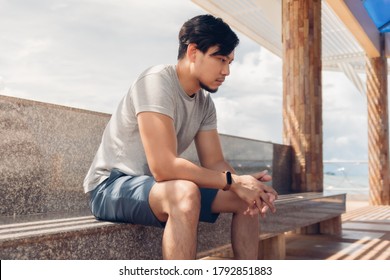 Lonely Asian man sitting in the hut by the sea chilling the atmosphere. - Powered by Shutterstock