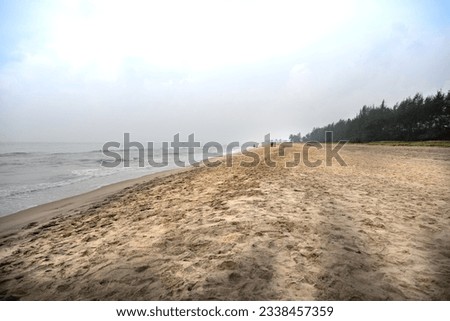 Lonely beaches of Pondicherry, India on a cloudy hazy morning