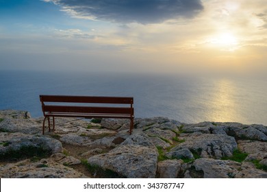 Lonely bench on the coast. Cape Cavo Greco. Cyprus