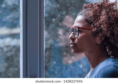 Lonely Black Woman Near Window Thinking About Something And Winter Snow