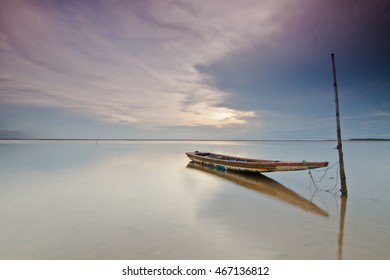 A lonely Boat at a beach in Kelantan Malaysia - Powered by Shutterstock