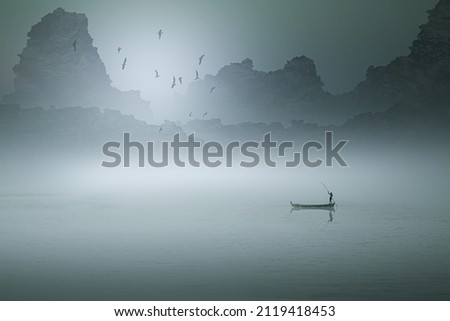 Lonely boat on the empty lake and rocky background, fantasy simple landscape photography