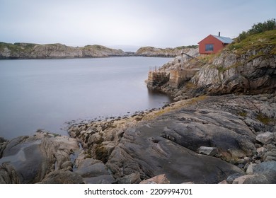 Lonely Cabin Next To The Sea In The Fiords Of Lofoten Islands, Norway