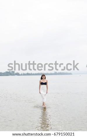 Similar – woman on the beach