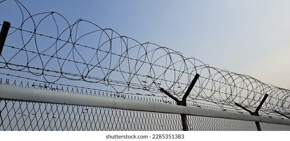 a lonely and desolate barbed wire - Powered by Shutterstock