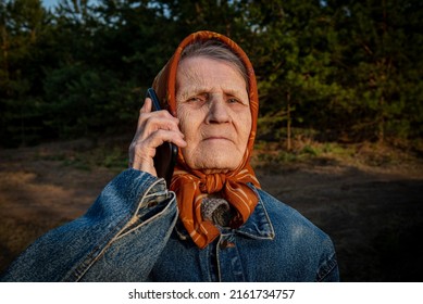 Lonely Elderly Woman Got Lost In Woods. Grandma Uses Smartphone Call Help. If You Get Lost In The Forest, Use Your Phone. Concept Of Rescue And Search For Lost Old People.