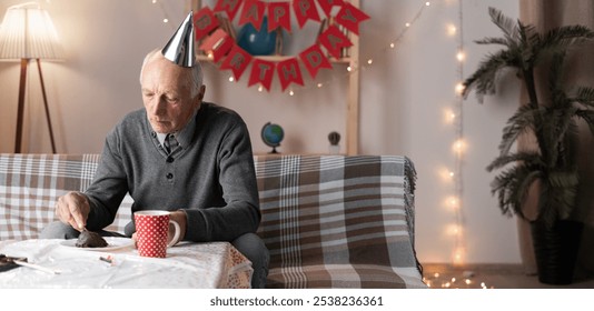 Lonely forgotten by children old man celebrating birthday alone eating holiday cake at home. Banner. Copy space - Powered by Shutterstock