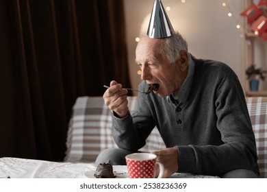 Lonely forgotten by children old man celebrating birthday alone eating holiday cake at home. Copy space - Powered by Shutterstock