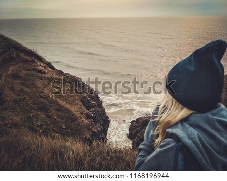 Similar – Image, Stock Photo Enjoy the view. Woman with headband, jacket. Ireland