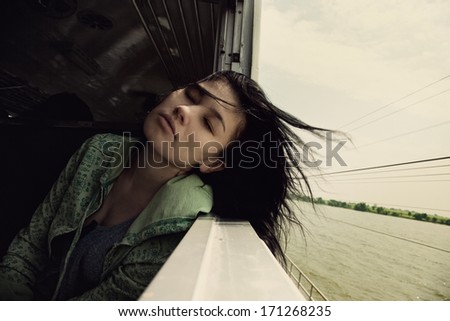 lonely girl rides on the train