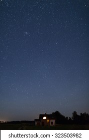 Lonely House In The Field. Night Sky Full Of Stars Above. Lithuania.