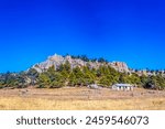 Lonely house in front of some mountains in the magical town of Creel Chihuahua in winter 