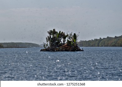 Lonely island in a Malagasy lake of the Pangalanes, Tom Sawyer and Huckleberry Finn moment, surf on the lens, Madagascar - Powered by Shutterstock