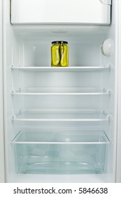 Lonely Jar Of Gherkins In Fridge. Front View