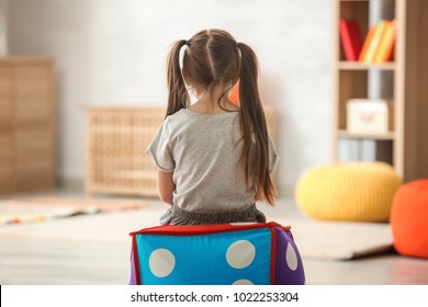 Lonely little girl at home. Autism concept - Shutterstock ID 1022253304
