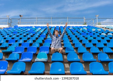 lonely man on the empty stadium seat cheering for the team, one man army concept - Shutterstock ID 1398287018