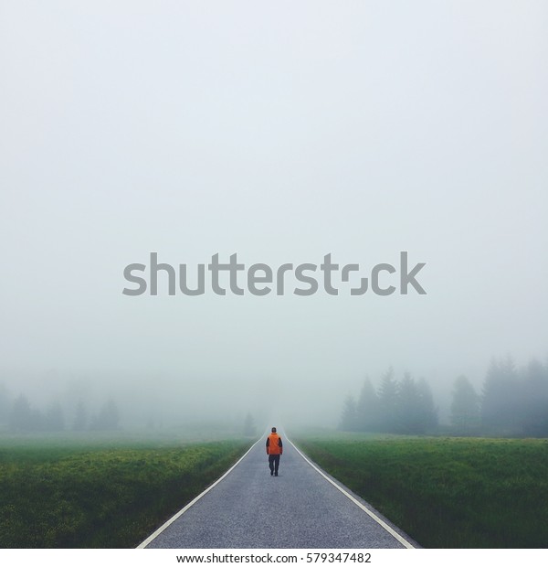 Lonely Man Walking Road Disappearing Fog Stock Photo Edit Now